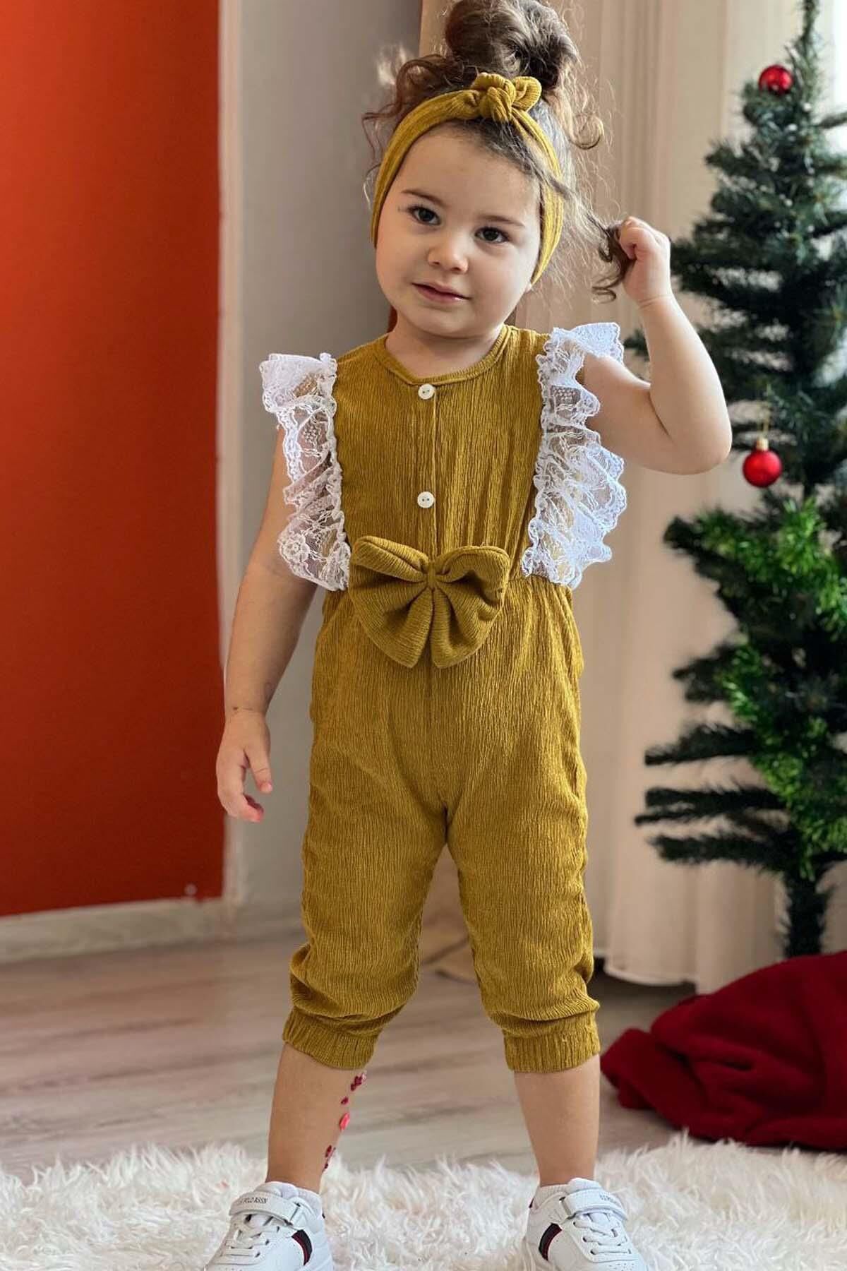 Kız Çocuk Omuzdan Göğse Dantel İşlemeli Beli Fiyonk Detaylı Bandanalı Hardal Tulum