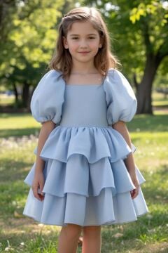 Kız Çocuk Kare Yaka Üzeri Kat Kat Pliseli Balon Kollu Kabarık Mavi Abiye