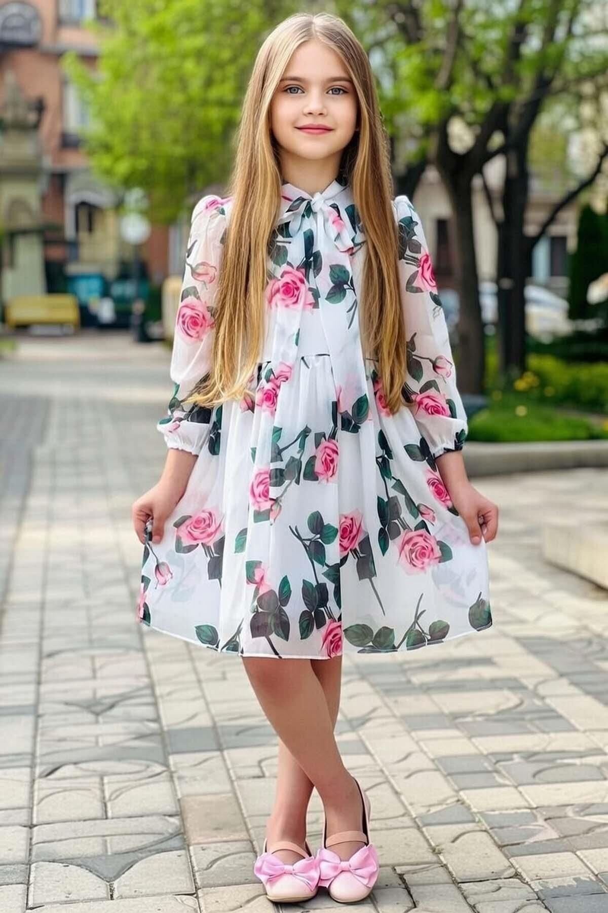 Kız Çocuk Üzeri Çiçek Baskılı ve Yakadan Bağlamalı Eteği Pliseli Beyaz Elbise