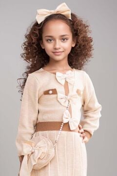 Kız Çocuk Beli Şerit ve Göğsü Fiyonk Detaylı Eteği Piliseli Krem Şifon Elbise