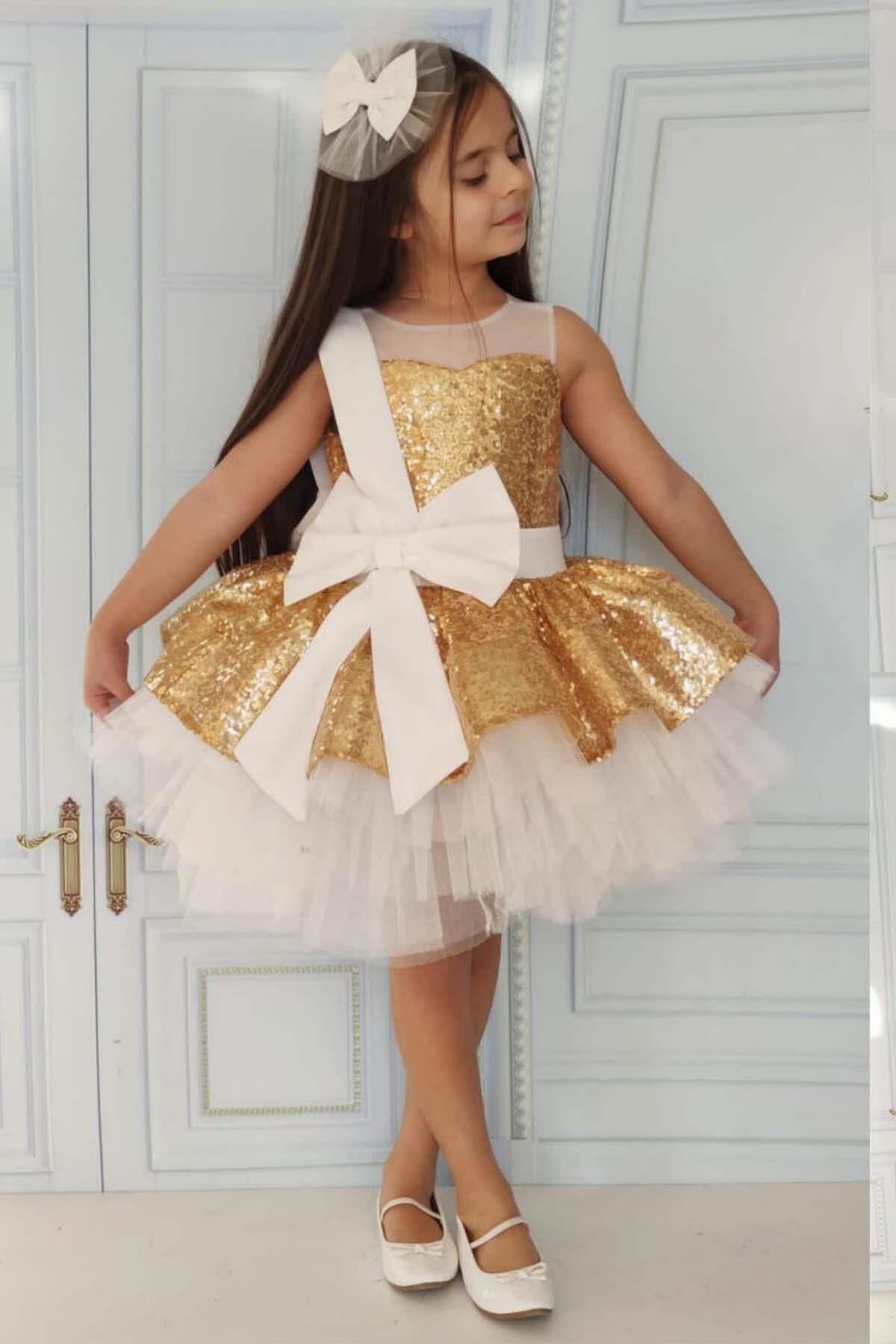 Kız Çocuk Önü ve Arkası Fiyonk Detaylı Üstü Pulpayet İşlemeli Etek Ucu Tüllü Gold Abiye